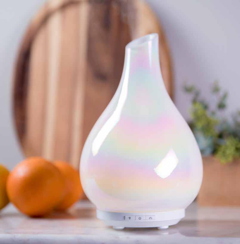 Bliss GLASS ESSENTIAL OIL DIFFUSER Suggested Retail $60.00 A beautiful hand-blown glass sculpture available in two styles glazed, iridescent opal and a brushed, glittering gold.