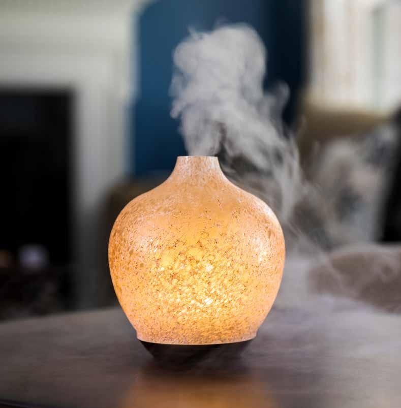 Lumiere GLASS ULTRASONIC ESSENTIAL OIL DIFFUSER Suggested Retail $60.00 Each hand-blown, pearlized gold glass cover features delicate texture detail exuding an overall aesthetic of natural rock.
