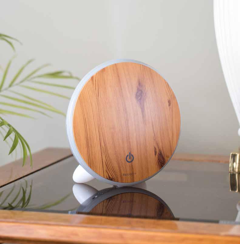 Lunar ESSENTIAL OIL DIFFUSER Suggested Retail $60.00 A unique disk=shape with natural wood grain integrates easily into many styles of home décor. misting diffuser white light Measures: 7 L x 3.