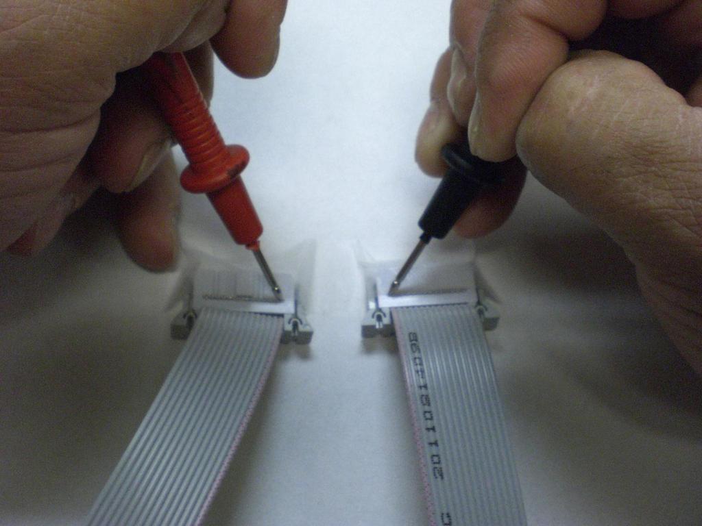 Inspect the Ribbon Cable (cont) The purpose of this test (OHMS Ω) is to check for a short in 1 of the wire strands on the ribbon cable.