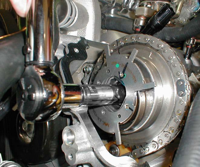 10. We can now remove the timing chain wedge. 11. Once the wedge is removed you can repeat the stock cam removal and install on the other side following the same steps and procedures.