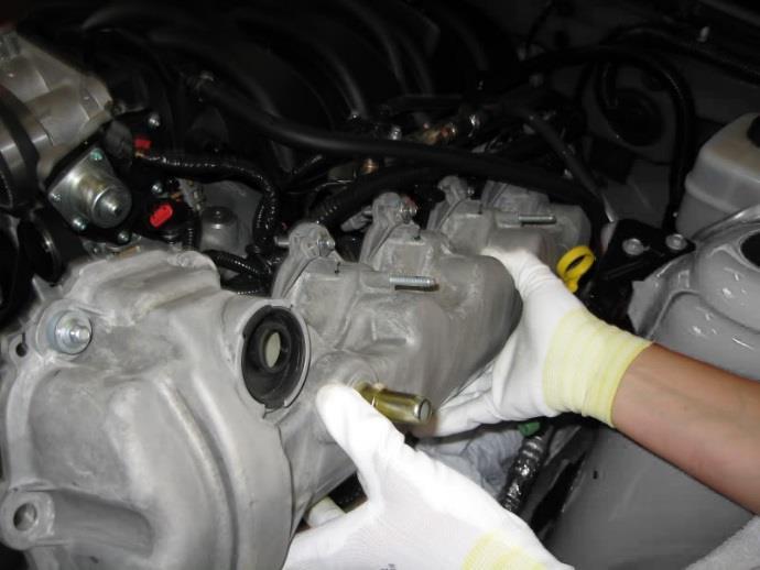 16. Remove each valve cover and set aside.