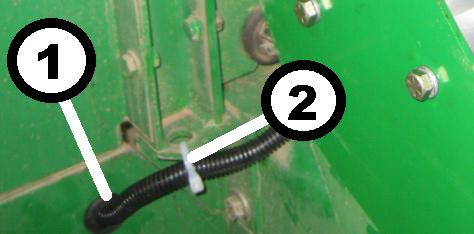 3.5.1.3 Electrical Cabinet Wiring Remove plug from opening in storage compartment. Route harness through compartment hole and install large grommet over harness (cut grommet to install).