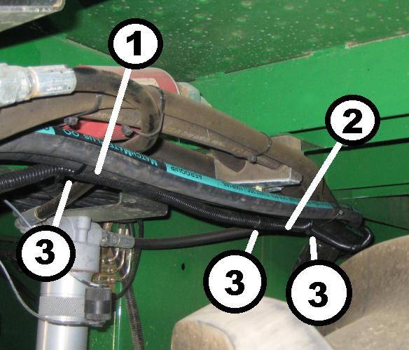 3.5.1.4 Routing of Harness to Multi-Coupler Route front segment of wire harness along reel hoses to multi-coupler. Secure with tie bands to the reel return hose (bottom port of multi-coupler).