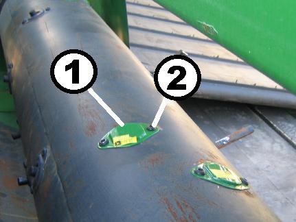 Remove fingers from the feeding auger as indicated in Figure 33.