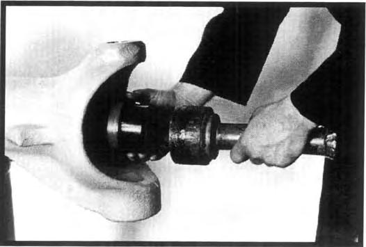 Drive it into the suspension yoke until it seats squarely against the shoulder of the bore. See Figure 15. Figure 17 Figure 15 2.