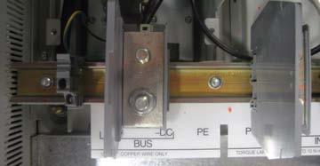 Remove at least two terminal blocks from the R, S, T Bus Bars at SCR DIN rail by pushing down on the metal tab on top of the terminal block while lifting the bottom of the terminal block out toward