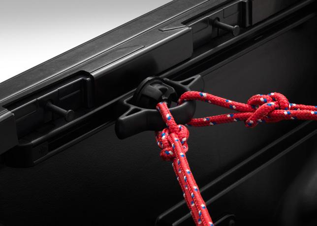 Fully adjustable, the bed cleat slides along the vehicle s bed rail system using a spring-loaded, twist/locking clamp