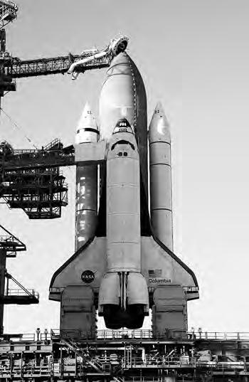 Figure 20-10. Space Transportation System. (NASA photo) The shuttle was selected in the early 1970s as the principal space launcher and carrier vehicle to be developed by NASA.