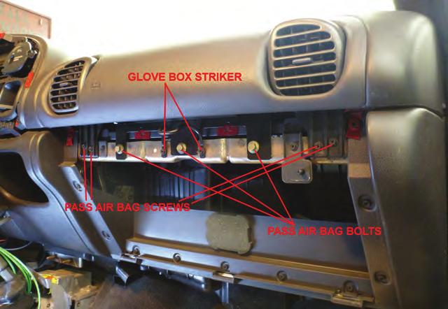 MEMBER 2 MEMBER.... Continued 10. Now remove the plastic strip that covers the glove box striker and the front airbag mounting screws as shown below: 13.
