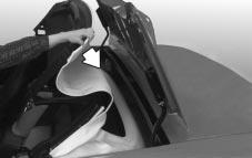 After the top is stored, apply one even push on the center of the front edge (A) of the convertible top to assure that the top is fully retracted. 9.