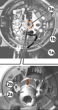 STEP 5: PLACE THE STEERIGN WHEEL SO IT IS FACE DOWN AND RETIGHTEN TEH 3 SCREWS IN THE BACK (1a). STEP 6: ENGAGE THE WIRING (1a) ONTO THE STEERING WHEEL (1b).