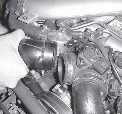 19. Remove the top end of the left intake pipe interfacing the throttle body boot