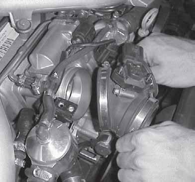 23. Remove throttle body boot by gently pulling out.