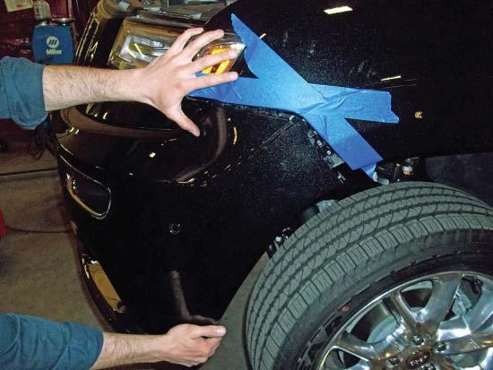 Trim the passenger side air deflector using the yellow lines in Figure J as a guide for trimming. 9.