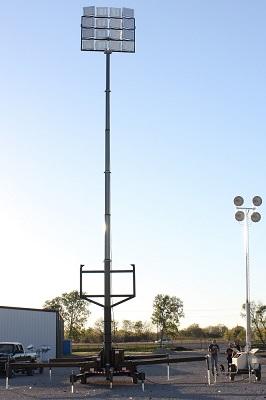 Click Images to enlarge. The above images show a side by side comparison of the WCDE-20-HLM65-20X500LTL-LED-WSM next to a 30' four lamp metal halide light plant.