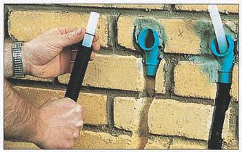 Use a spirit level to check the position of the covers vertically and horizontally. Mortar the covers in position. Allow the mortar to dry before proceeding further.