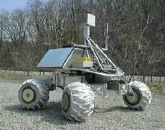 (a) Nomad: 4 wheeled rover (a) Sojourner: the Mars rover with Rocker-bogie suspension rocker body bogie Fig.