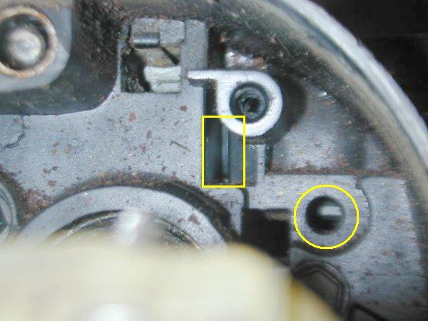 If there is a screw were the the yellow CIRCLE is located then simply remove this screw and put the key in the ON position and remove the lock cylinder.