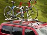 Carrying clamps feature rubber inserts to help protect bike surfaces. Both styles attach to Sport-Utility Bars and two carriers can be used on one roof rack.