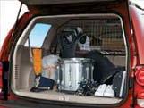 00 INTERIOR CCESSORIES Storage Compartment Partition Black steel partition helps keep cargo and pets safe and secure in the cargo area and prevents either from entering the passenger compartment.