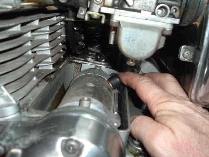 Here I am routing the stator wires along the right side of the starter and out of the slot in the back.