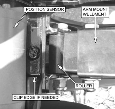 Due to the existing plastic slide attached to the side of the JD Reel Arm for the Position Sensor (Figure 2), some minor adjustments may be needed to the reel arm mount to ensure a proper fit.