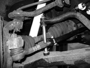 Figure 40 64. Install the torsion bar into the lower control arms using the alignment marks made earlier.