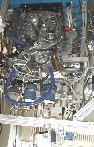 Figure 2. Research engine with the q-switched Nd:YAG laser system 3.2. Engine experiments Since the first feasibility experiments could be concluded successfully, an engine was modified for laser ignition.