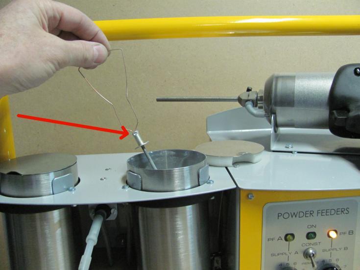 The powder feeder valve should be covered by powder