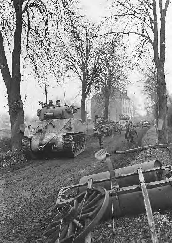 120 TANKS M4 Sherman medium tanks and infantry of the Third U.S. Army moving toward Metz, the last German stronghold in France, 1944. Courtesy of Art-Tech/Aerospace/M.A.R.S/TRH/Navy Historical.