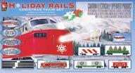 A diesel loco with working headlight heads up 3 freight cars and a caboose, all festively decorated. Includes a huge 38 x 54" track oval, power pack and more. 931-875 White, Red, Green Reg.