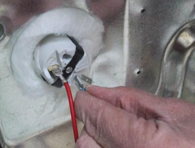Remove the white wire to the oven light. Connect the Safe-Telement wire to the oven light. (Fig.