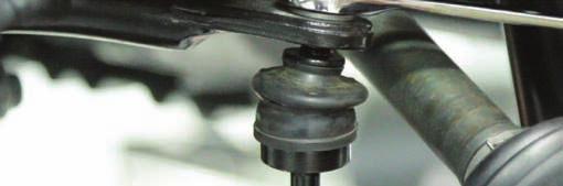 Use the appropriate tool to release ball joint from knuckle. See Photo 11. 15.