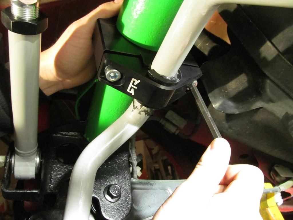 With the axle bracket in place, hold up the sway bar and install and snug the bolt using the 8mm allen wrench.