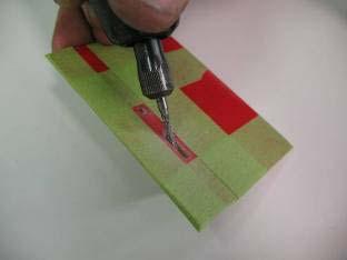 Use a carbide cutter and a Perma Grit file to open the slot.