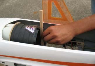 It may help to use strips of masking tape to help hold the inlet sections to the intakes. Bolt the fan into position on the rails of the fan mount and over the inlets.