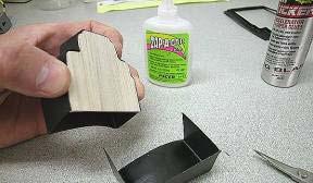 Use curved plastic scissors, then a sanding block to smooth the cut edges.