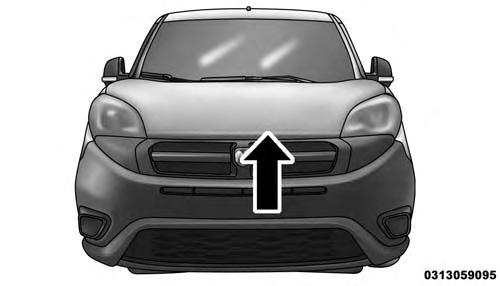 2. Move to the outside of the vehicle, reach into the opening beneath the center of the hood and push up the
