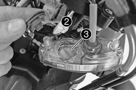 ( p. 74) Remove screws. Pull the speedometer out of the bracket from above. 100875-10 Using a coin, turn locking cap counterclockwise all the way and remove it.