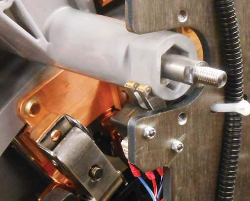6. Use a 3/32" Allen wrench and a 1/4" socket wrench to loosen and remove the self-locking nuts and logic switch mounting screws.