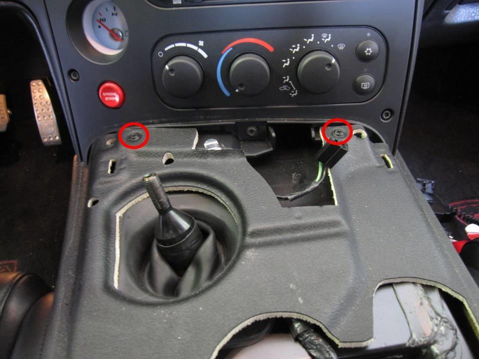 2 Remove the center console Remove the 2 forward screws Move both seats to their most forward position