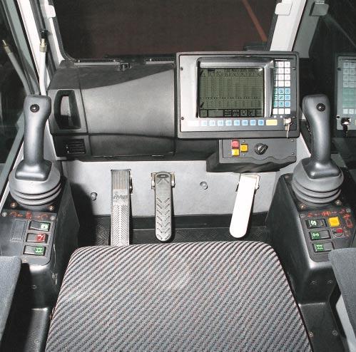 Spring-mounted and hydraulically cushioned crane operator s seat with pneumatic lumber support and headrest Operator-friendly armrest-integrated controls,