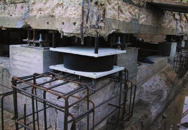 isolator upper plate; positioning the superstructure reinforcement followed by concrete casting.