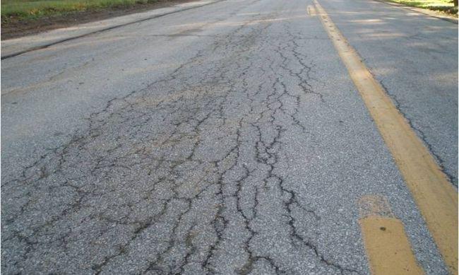 ALLIGATOR CRACKING (FATIGUE) Alligator or fatigue cracking is a series of interconnecting cracks caused by fatigue failure of the asphalt concrete surface under repeated traffic loading.