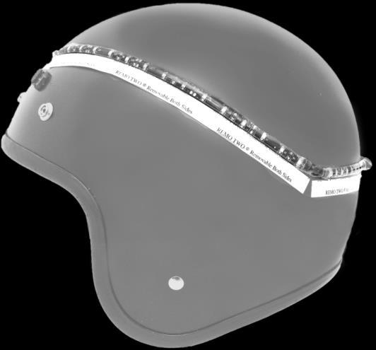 Starting at the vertical midline, press the two short pieces of tape onto each side of your helmet. The tape should not run across any sharp angles or around corners.