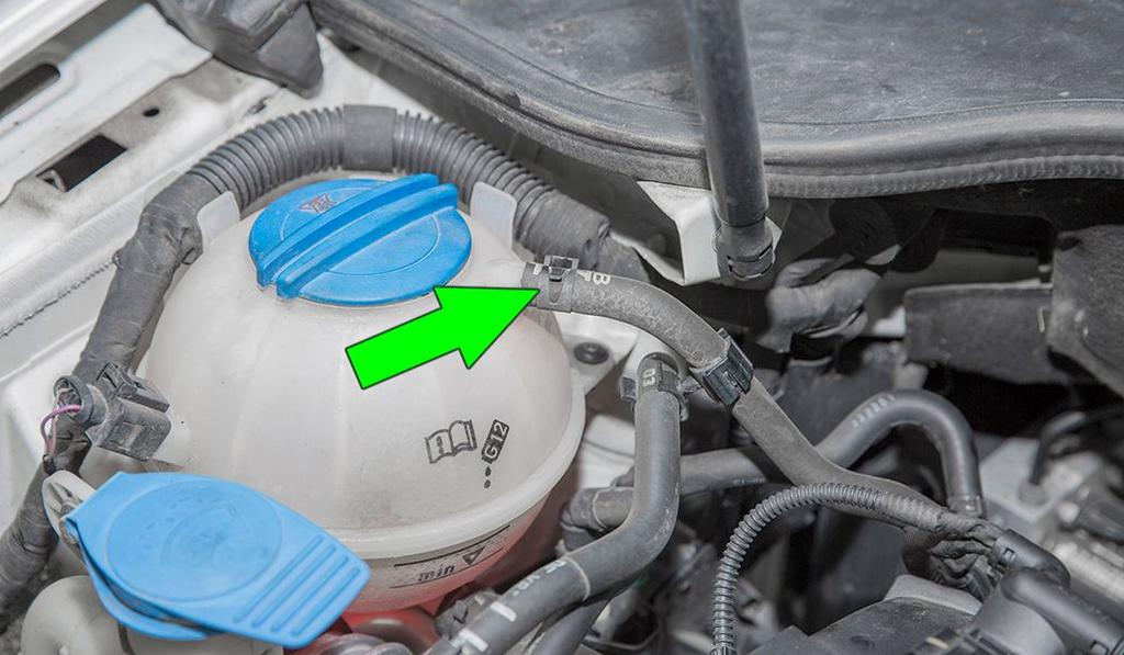 Loosen the coolant bottle cap to release pressure from the