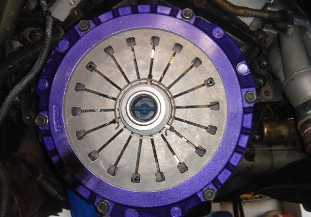 Take the pressure plate and the clutch disc and place them together as you were ready to install them on the car, make sure that you have the clutch disc facing the right direction, it should have a