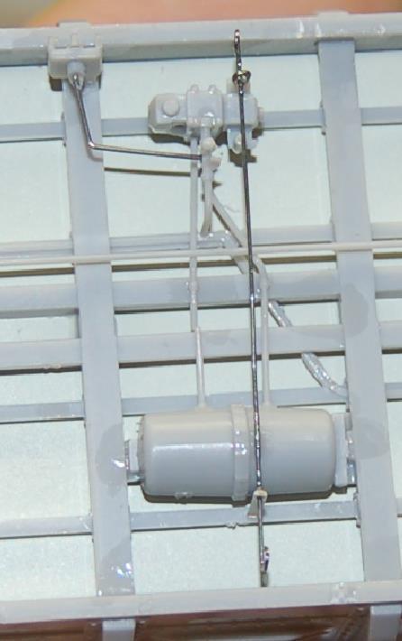 19. Install the release rod lever assembly. There are three wire parts to the release rod lever assembly; the wire lever, a wire eyebolt, and a wire bracket.