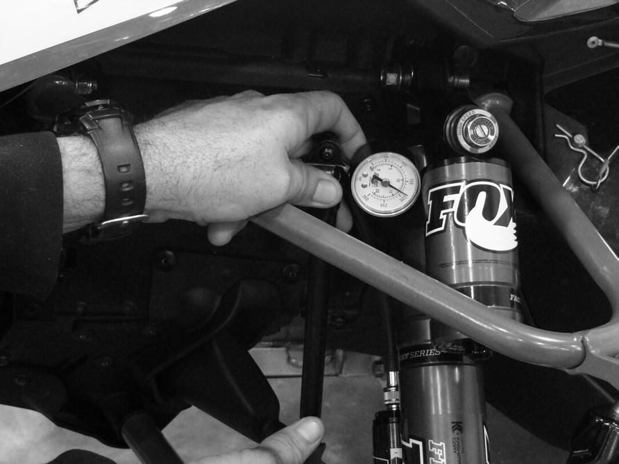 FLOAT 3 EVOL SERIES SETUP Step 1 Ensure that your snowmobile is safely supported with a floor jack or jack stand with the skis off the ground. Remove the EVOL air spring filler cap.